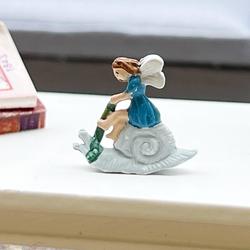 Miniature Fairy On Snail